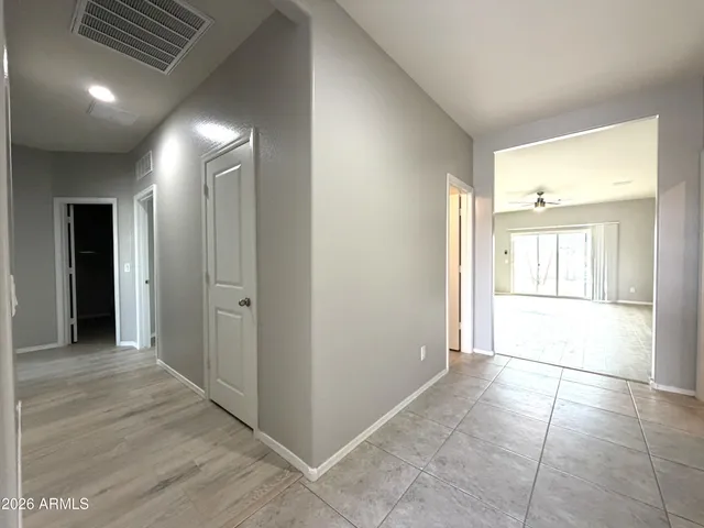 a view of livingroom with an empty space and a window