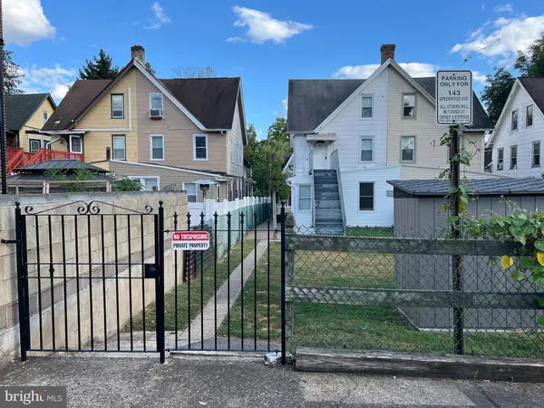 a view of house and a yard