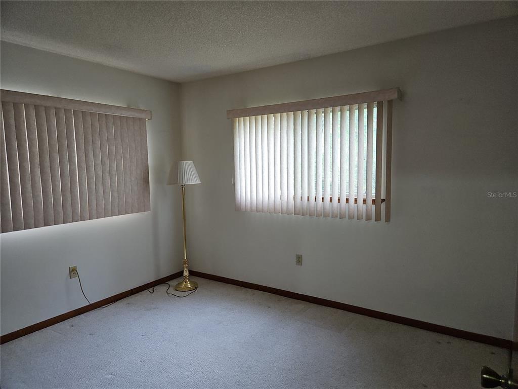 11087 Southwest 77th Court Ocala, FL 34476 - Photo 15 of 31 an empty room with windows