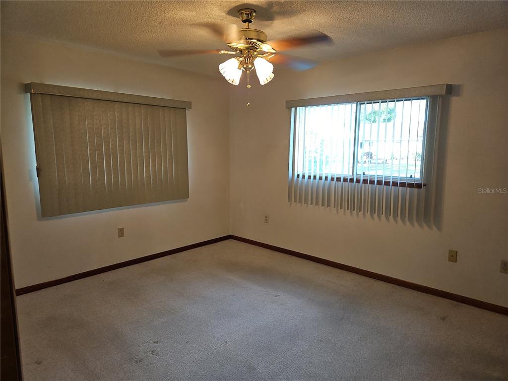 11087 Southwest 77th Court Ocala, FL 34476 - Photo 17 of 31 a view of an empty room with a window