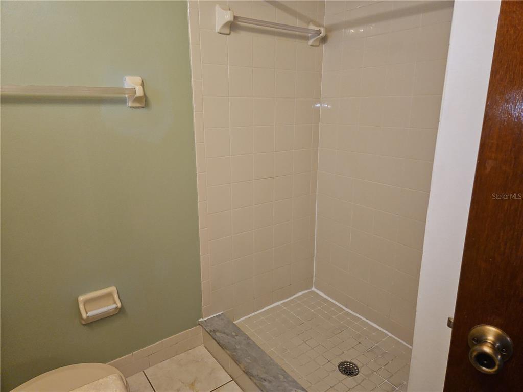 11087 Southwest 77th Court Ocala, FL 34476 - Photo 20 of 31 a bathroom with a granite countertop sink