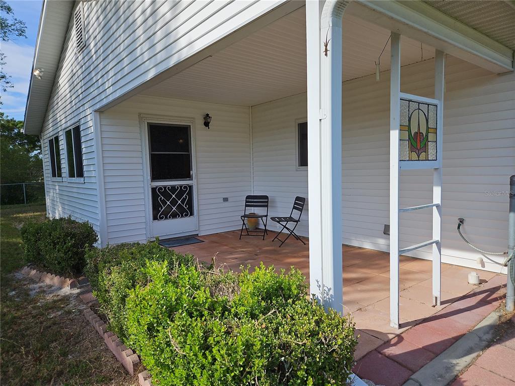 11087 Southwest 77th Court Ocala, FL 34476 - Photo 22 of 31 a backyard of a house with seating space