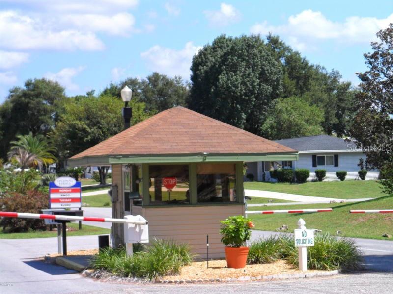 11087 Southwest 77th Court Ocala, FL 34476 - Photo 28 of 31 a front view of a house with garden