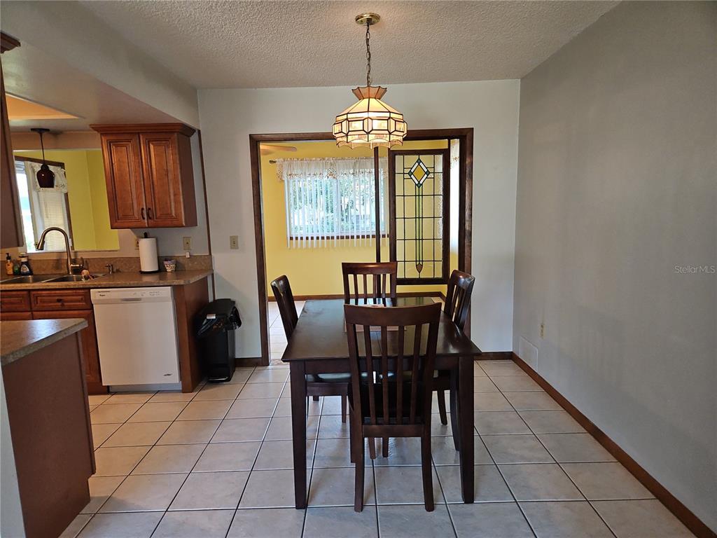 11087 Southwest 77th Court Ocala, FL 34476 - Photo 5 of 31 a view of a dining room with furniture and window