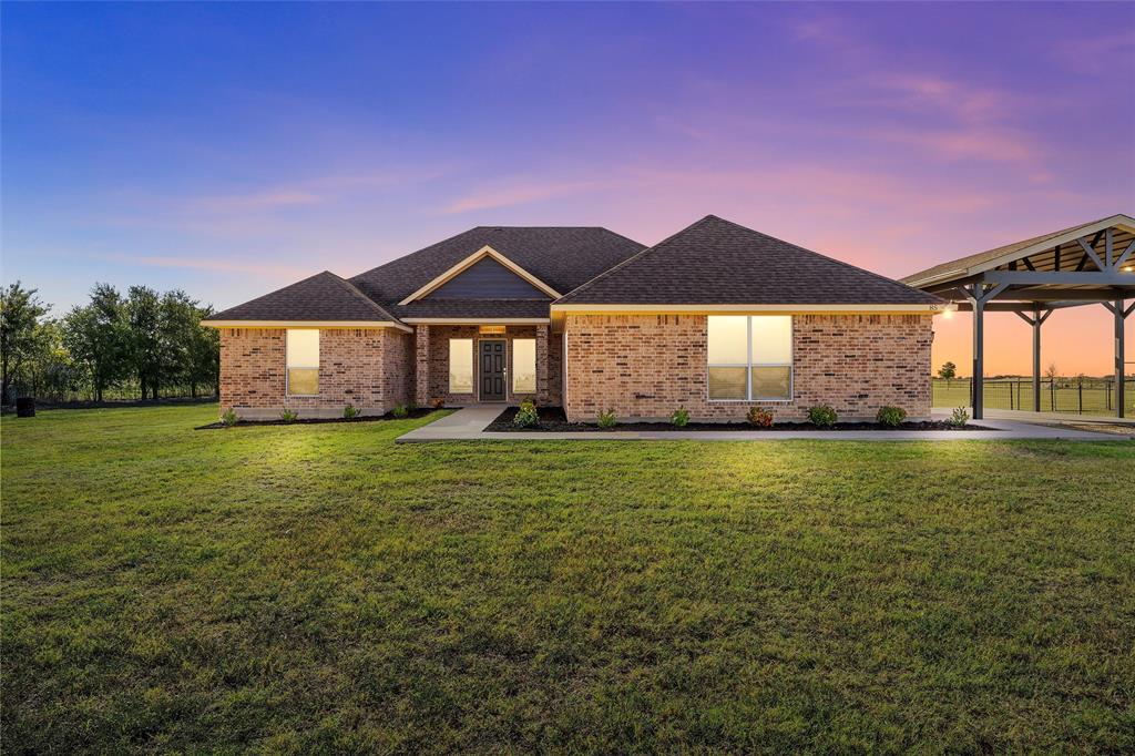 Single story home featuring a gazebo and a yard