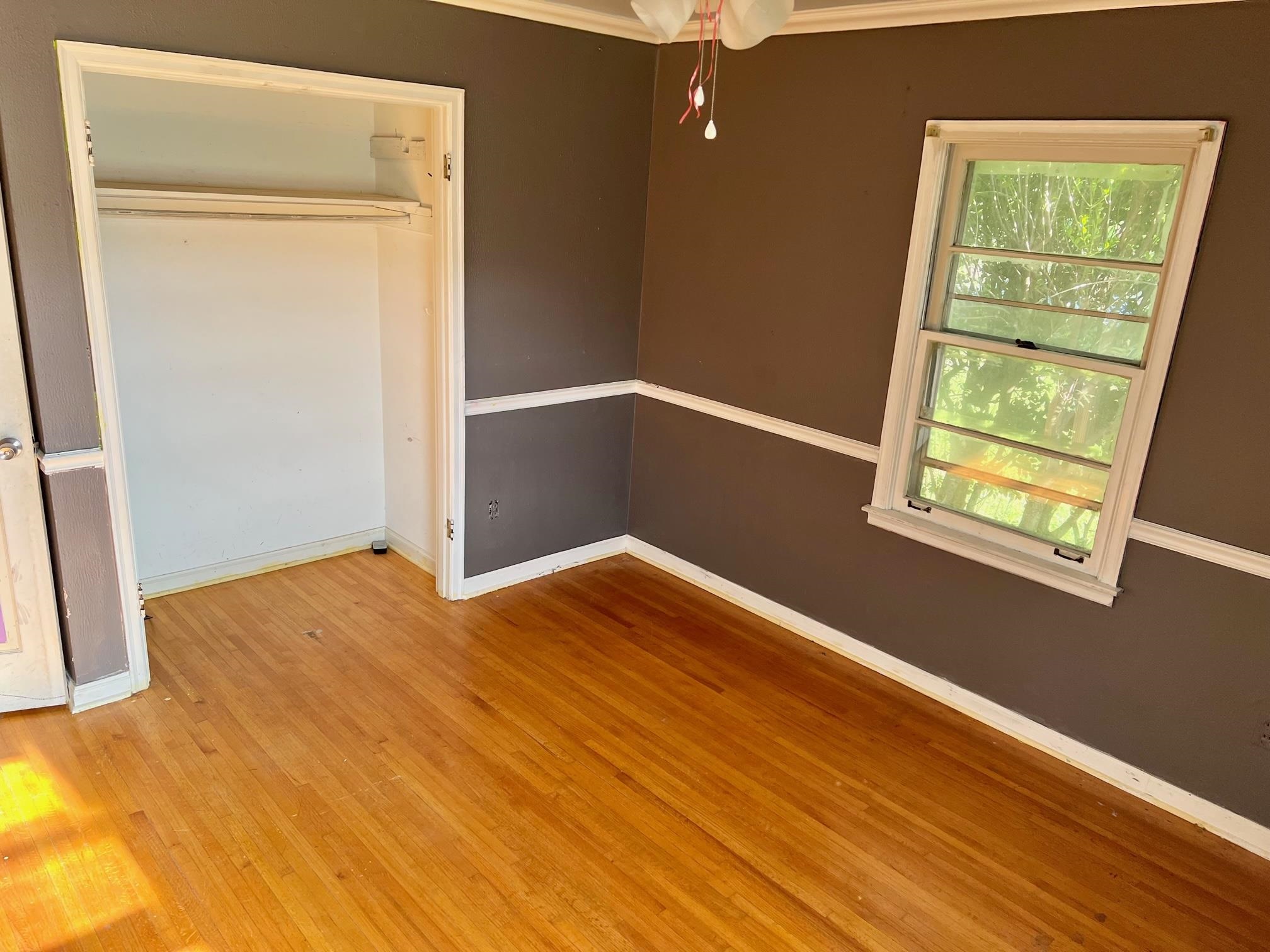 4356 Grey Road Memphis, TN 38108 - Photo 19 of 22 a view of empty room with wooden floor and fan