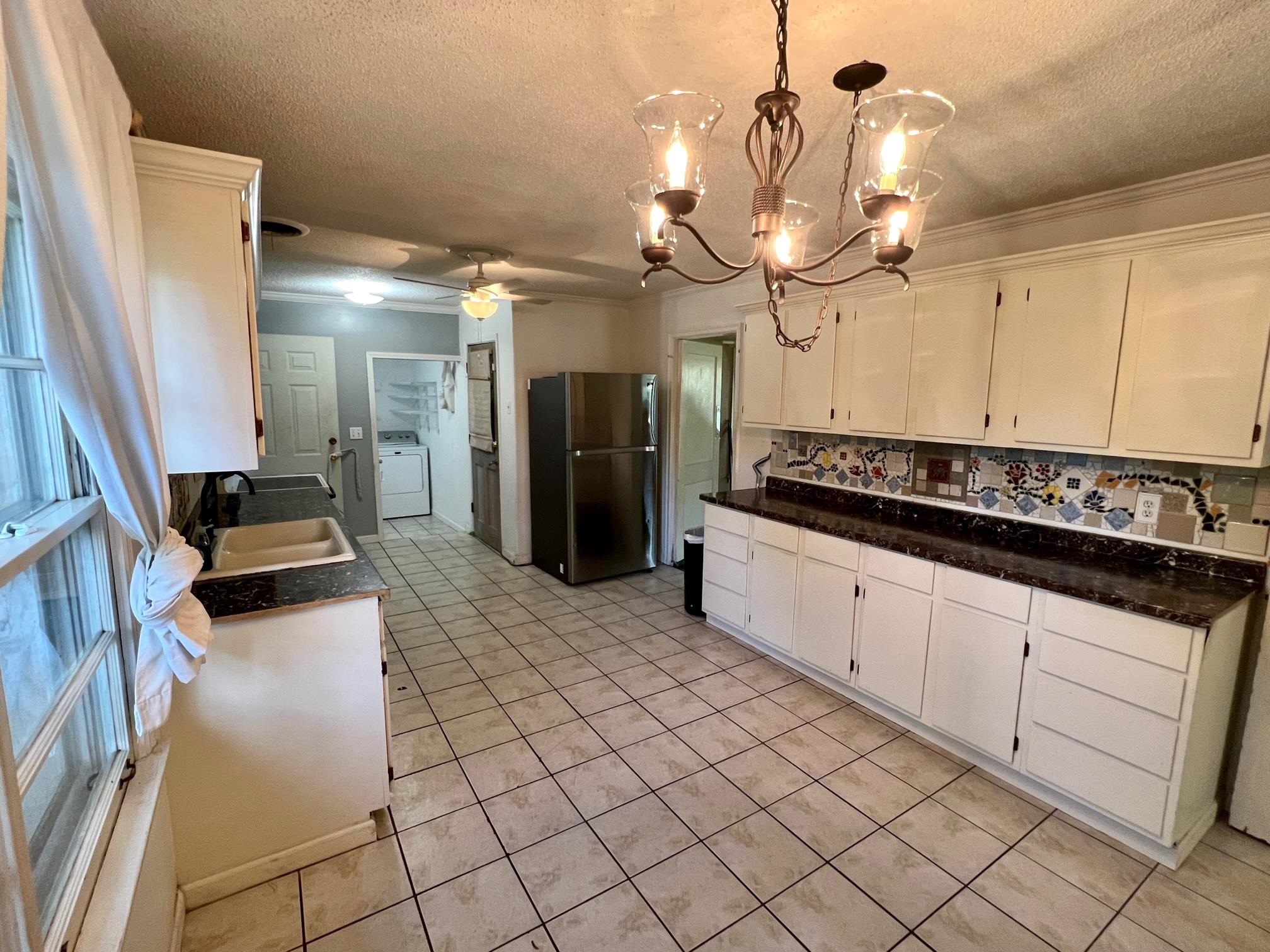 4356 Grey Road Memphis, TN 38108 - Photo 7 of 22 a kitchen with a sink and cabinets