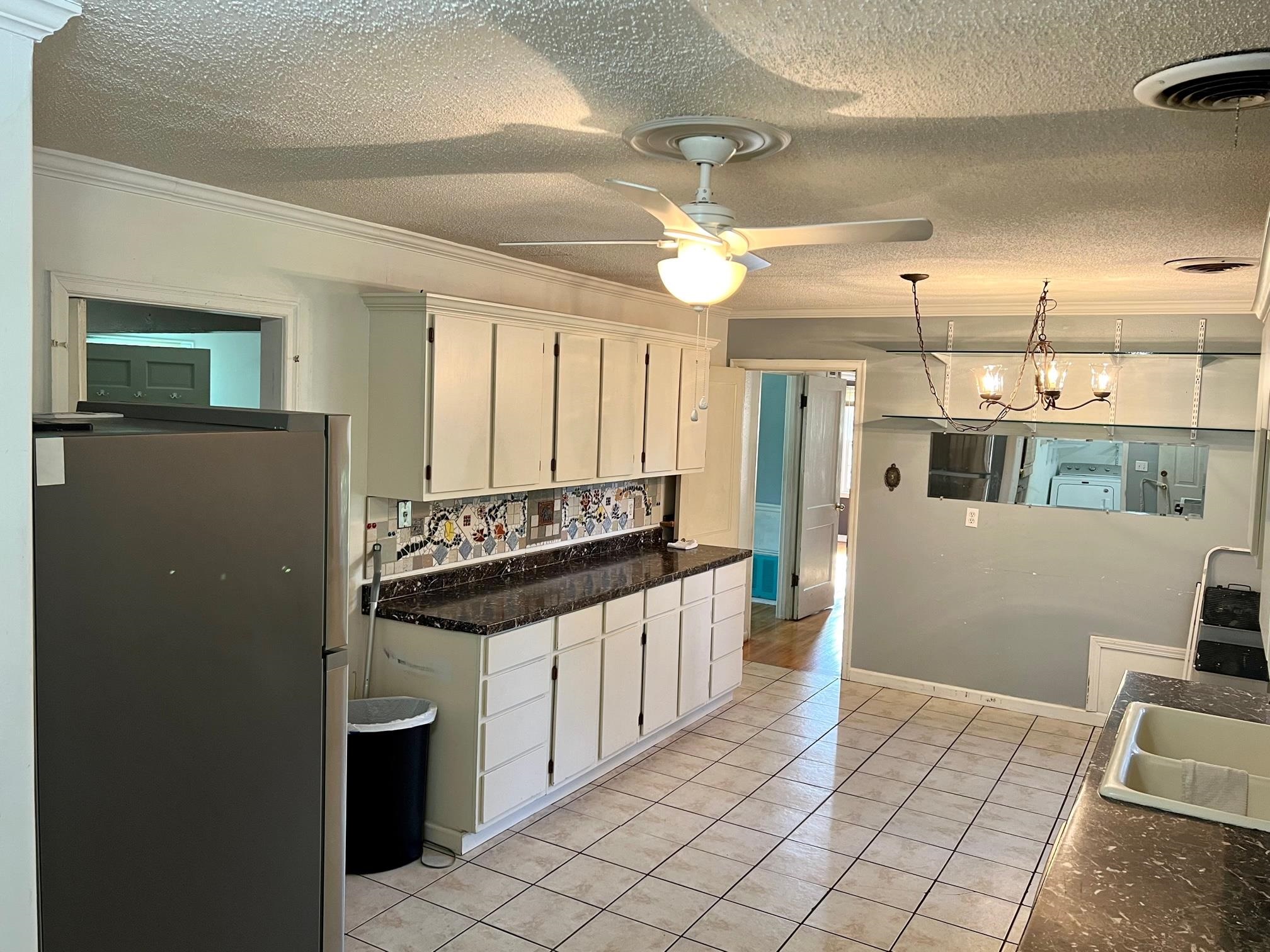 4356 Grey Road Memphis, TN 38108 - Photo 9 of 22 a kitchen with stainless steel appliances a refrigerator and a stove