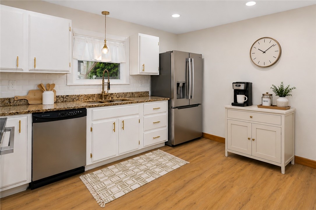 461 River Road Lincoln, RI 02865 - Photo 4 of 32 Eat in Kitchen with new stainless appliances, easy-care lvp flooring, and granite countertops