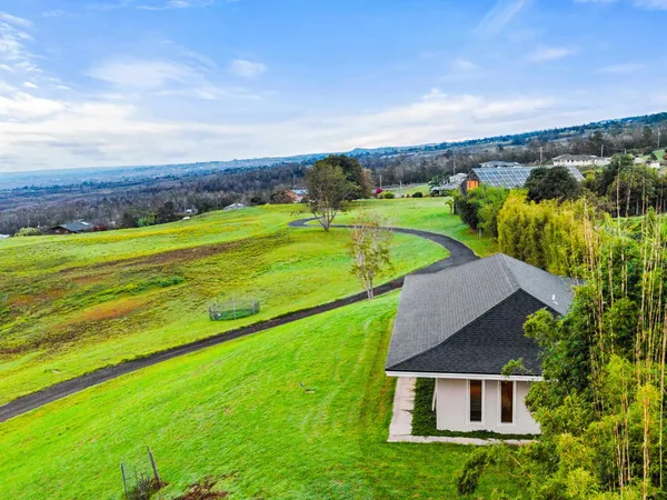 aerial view of a house with big yard