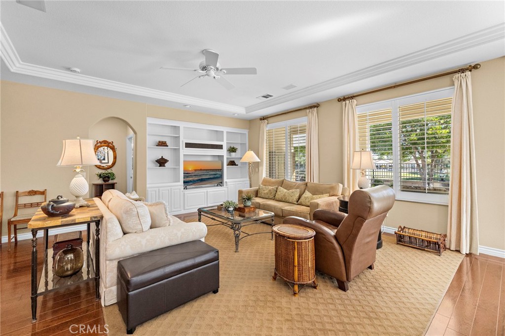 28545 Raintree Drive Menifee, CA 92584 - Photo 17 of 33 a living room with furniture fireplace and a large window