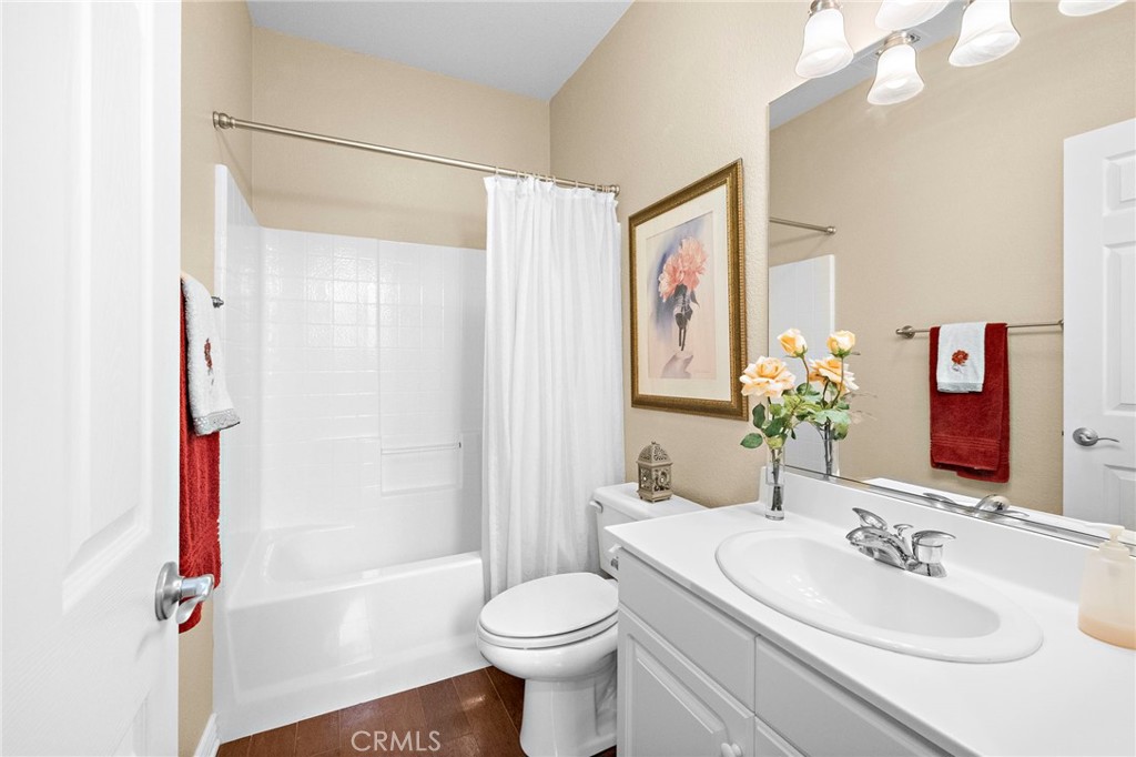 28545 Raintree Drive Menifee, CA 92584 - Photo 21 of 33 a bathroom with a sink toilet and shower