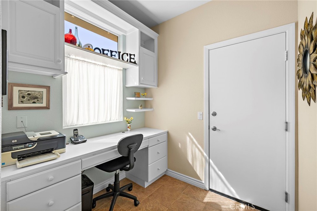 28545 Raintree Drive Menifee, CA 92584 - Photo 27 of 33 a view of a workspace with furniture and a window