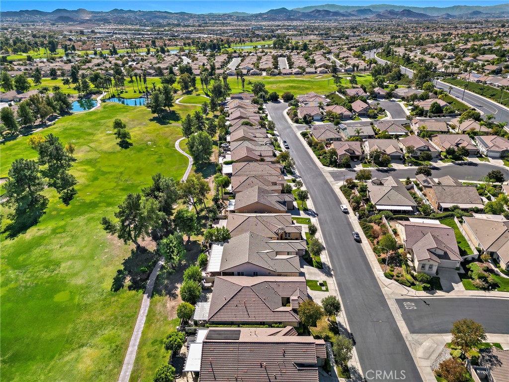 28545 Raintree Drive Menifee, CA 92584 - Photo 3 of 33 an aerial view of residential houses with outdoor space