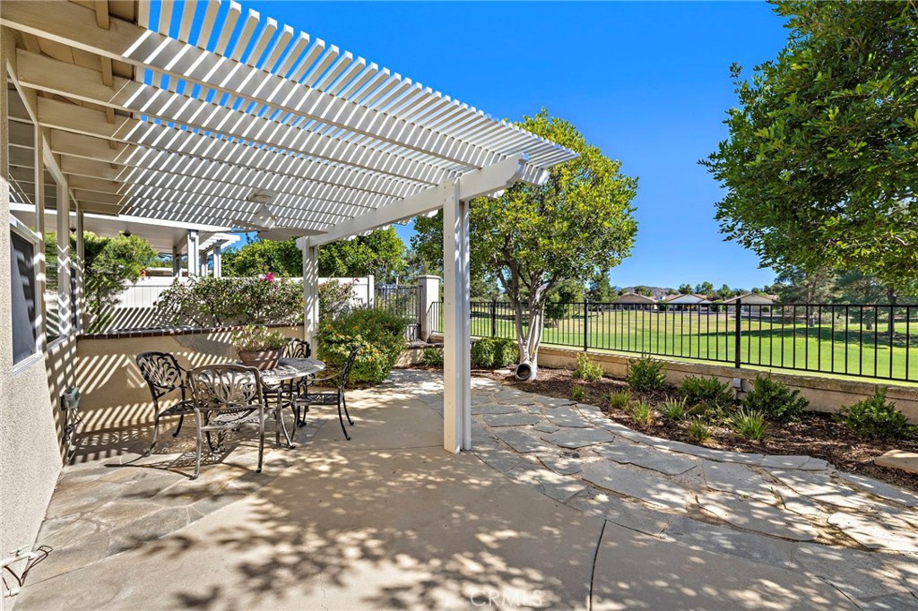 28545 Raintree Drive Menifee, CA 92584 - Photo 31 of 33 a view of a chair and tables in the patio