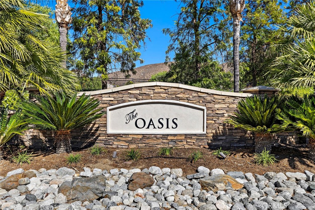 28545 Raintree Drive Menifee, CA 92584 - Photo 33 of 33 a sign broad in front of a red brick house