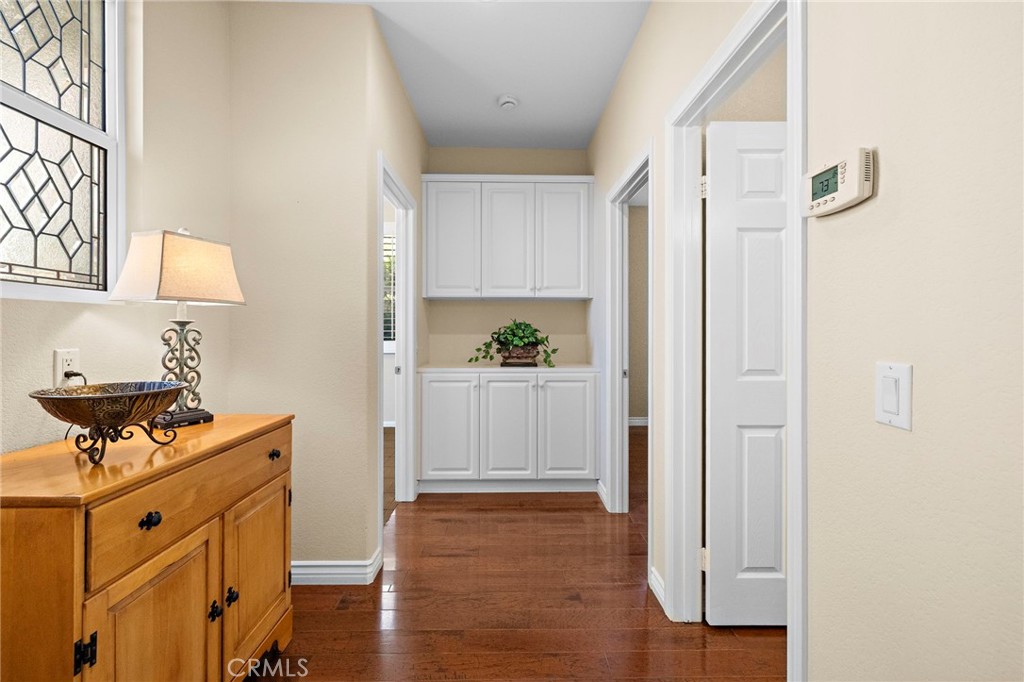 28545 Raintree Drive Menifee, CA 92584 - Photo 8 of 33 a view of a kitchen with wooden floor and electronic appliances