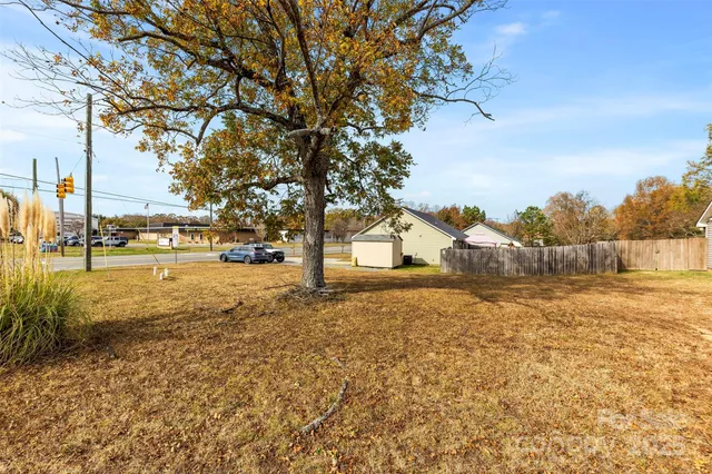 a view of road with large trees