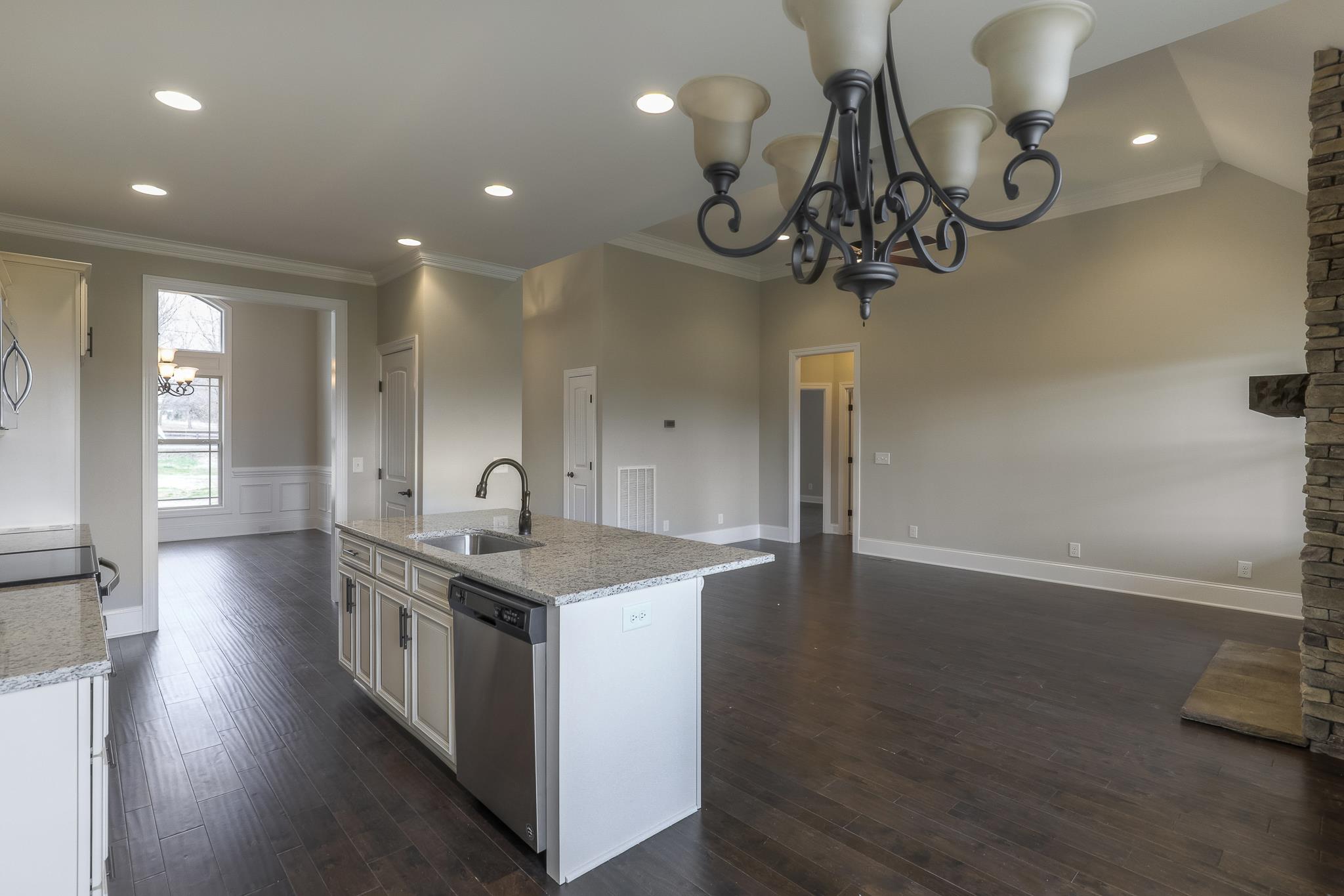254 Bates Road Lebanon, TN 37087 - Photo 8 of 20 a kitchen with stainless steel appliances granite countertop a sink a stove and wooden floor