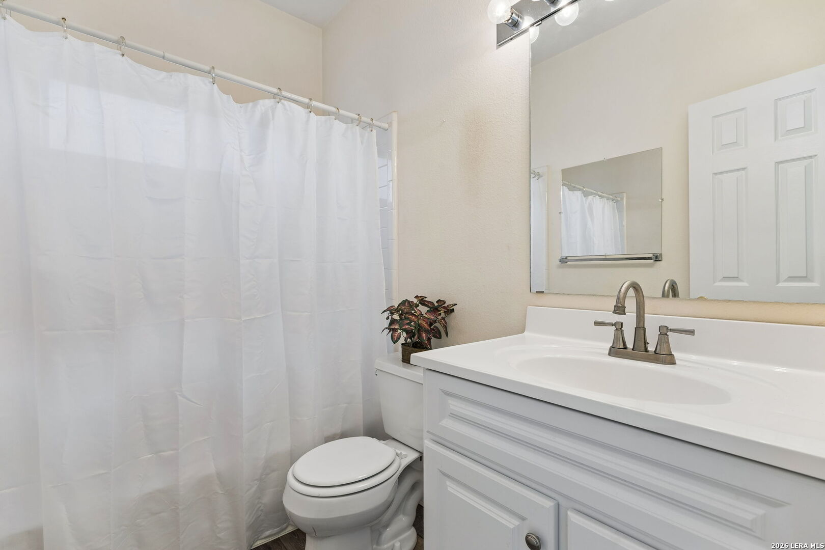 15314 Spring Land San Antonio, TX 78247 - Photo 18 of 49 a bathroom with a sink a toilet and a mirror