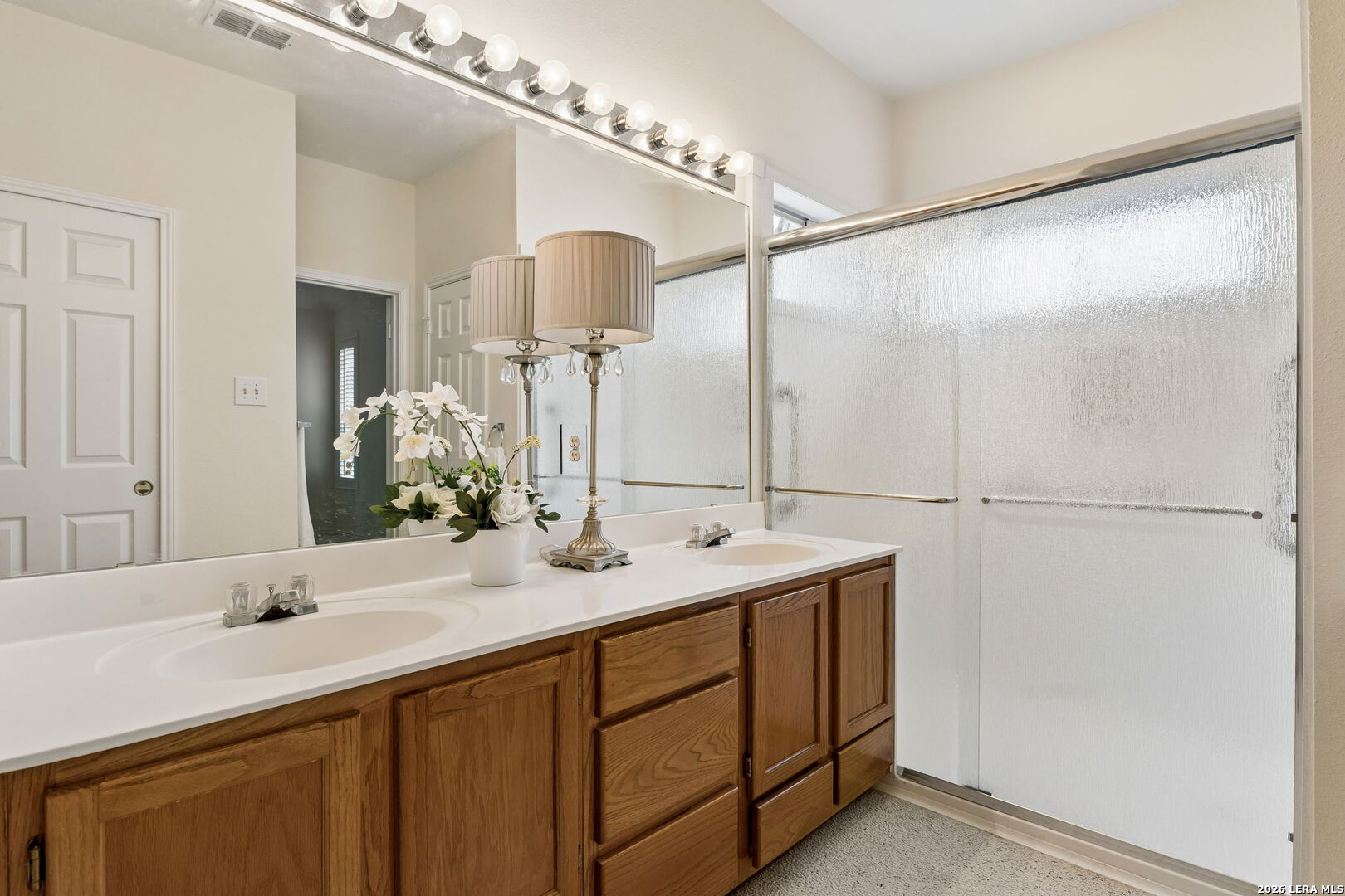 15314 Spring Land San Antonio, TX 78247 - Photo 20 of 49 a bathroom with a sink and a mirror