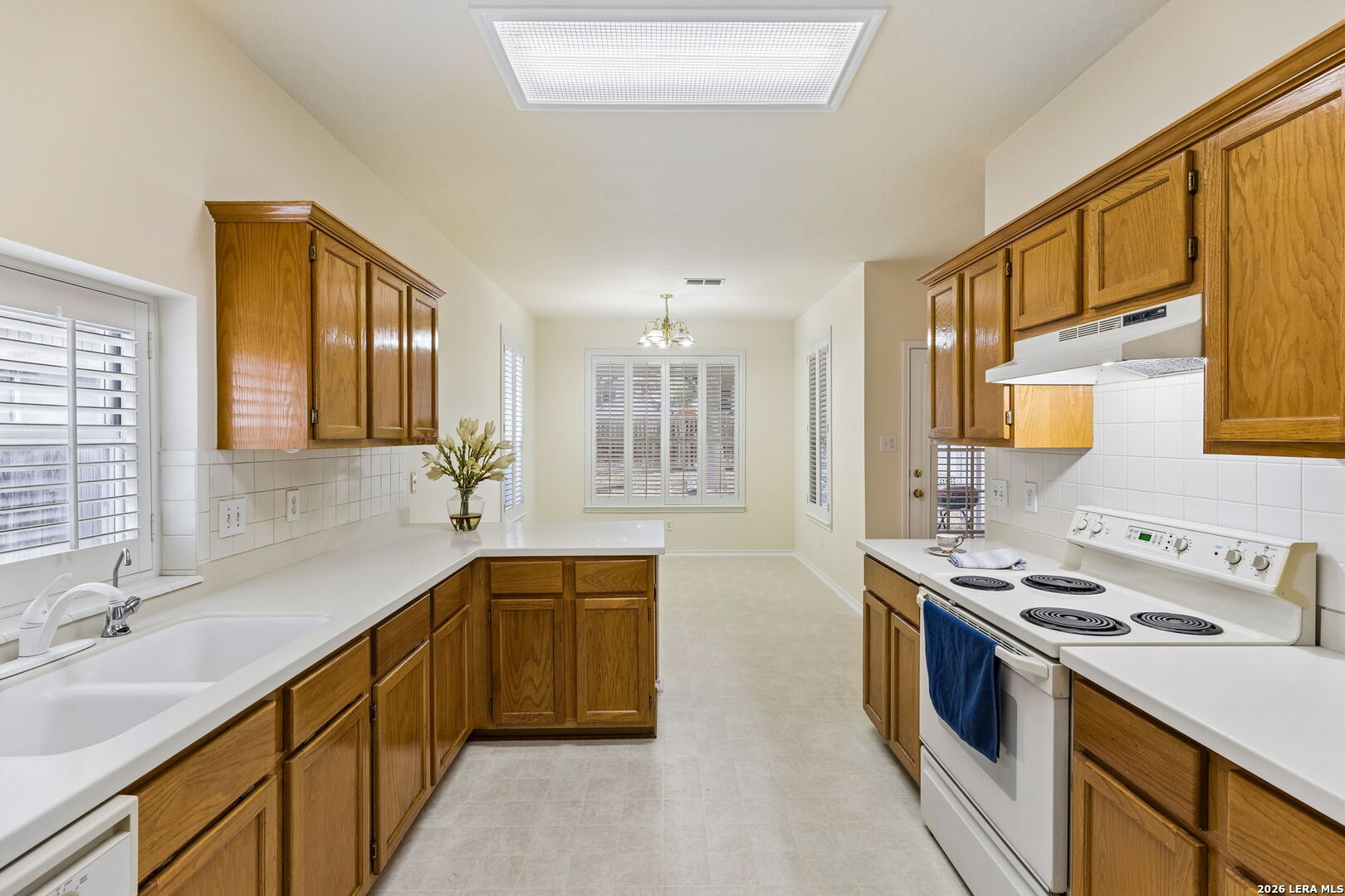 15314 Spring Land San Antonio, TX 78247 - Photo 26 of 49 a kitchen with stainless steel appliances a sink stove and cabinets