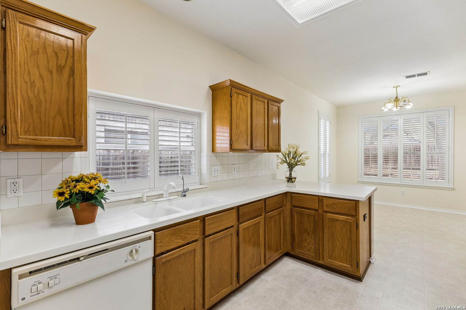 15314 Spring Land San Antonio, TX 78247 - Photo 27 of 49 a kitchen with a sink and cabinets