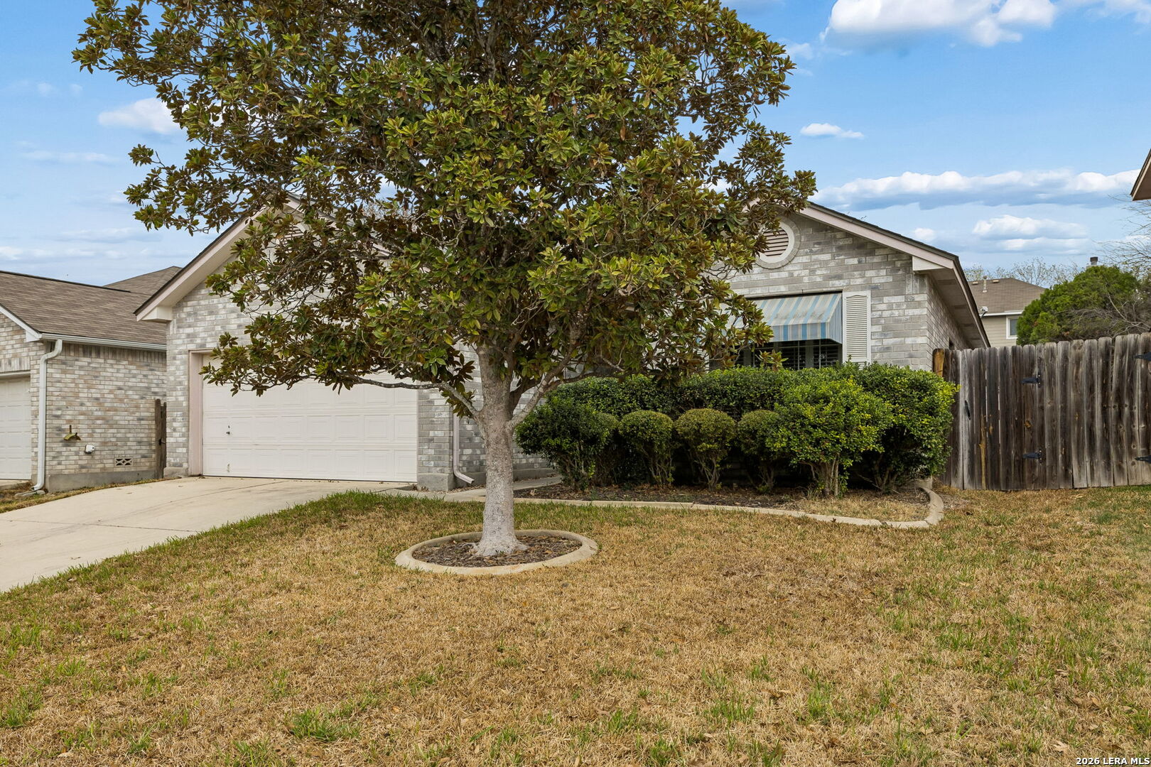 15314 Spring Land San Antonio, TX 78247 - Photo 3 of 49 a front view of a house with a yard
