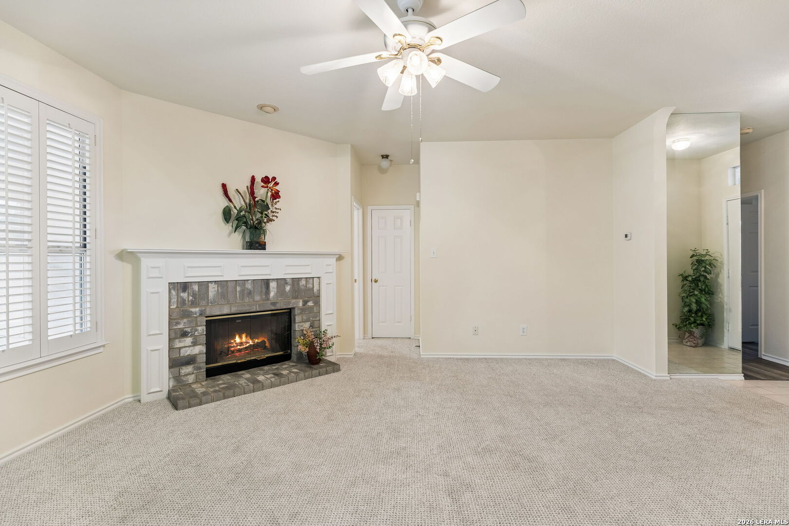 15314 Spring Land San Antonio, TX 78247 - Photo 34 of 49 an empty room with fireplace and fan