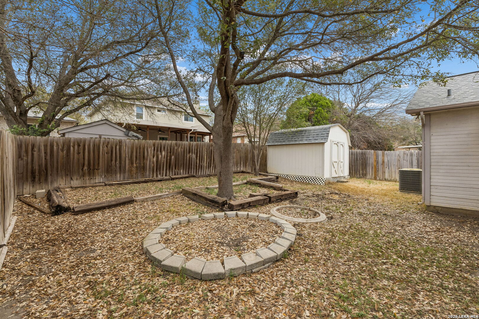 15314 Spring Land San Antonio, TX 78247 - Photo 43 of 49 a view of a backyard with a tree