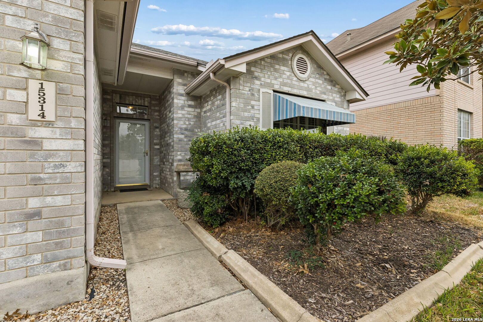 15314 Spring Land San Antonio, TX 78247 - Photo 5 of 49 a front view of a house with garden