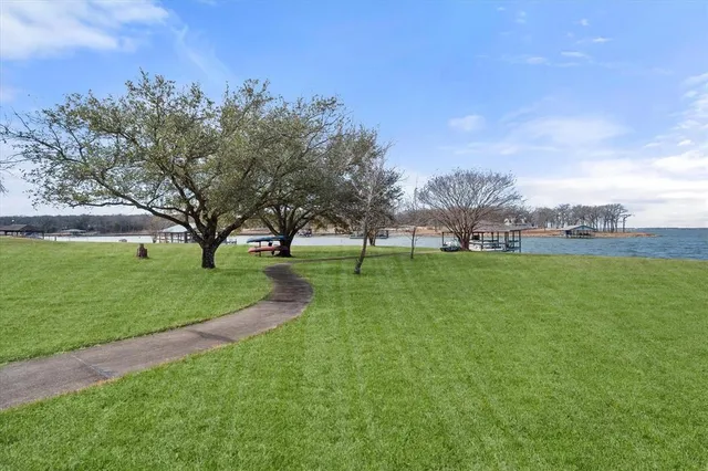 with view of swimming pool with a yard