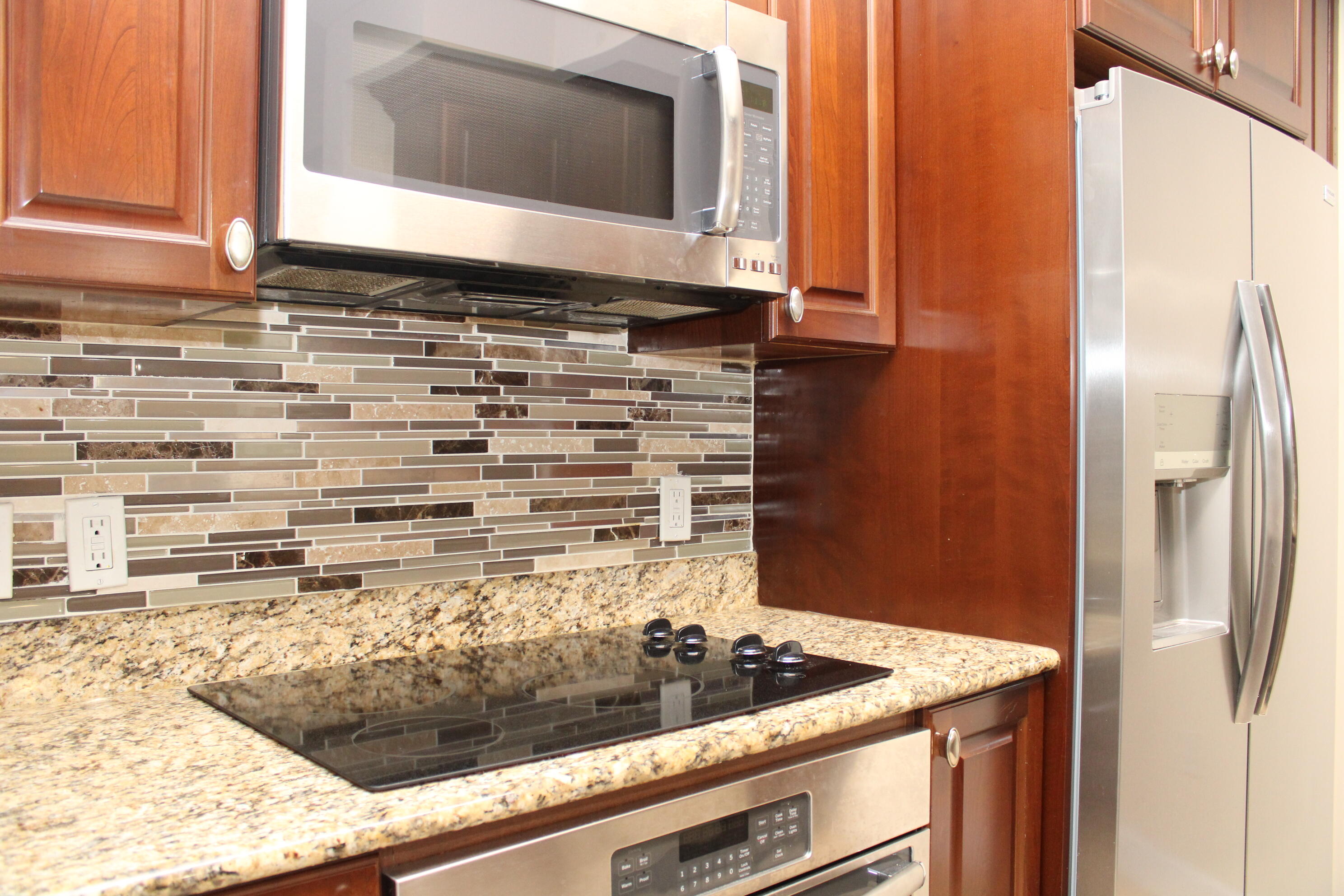 a kitchen with a stove and a microwave