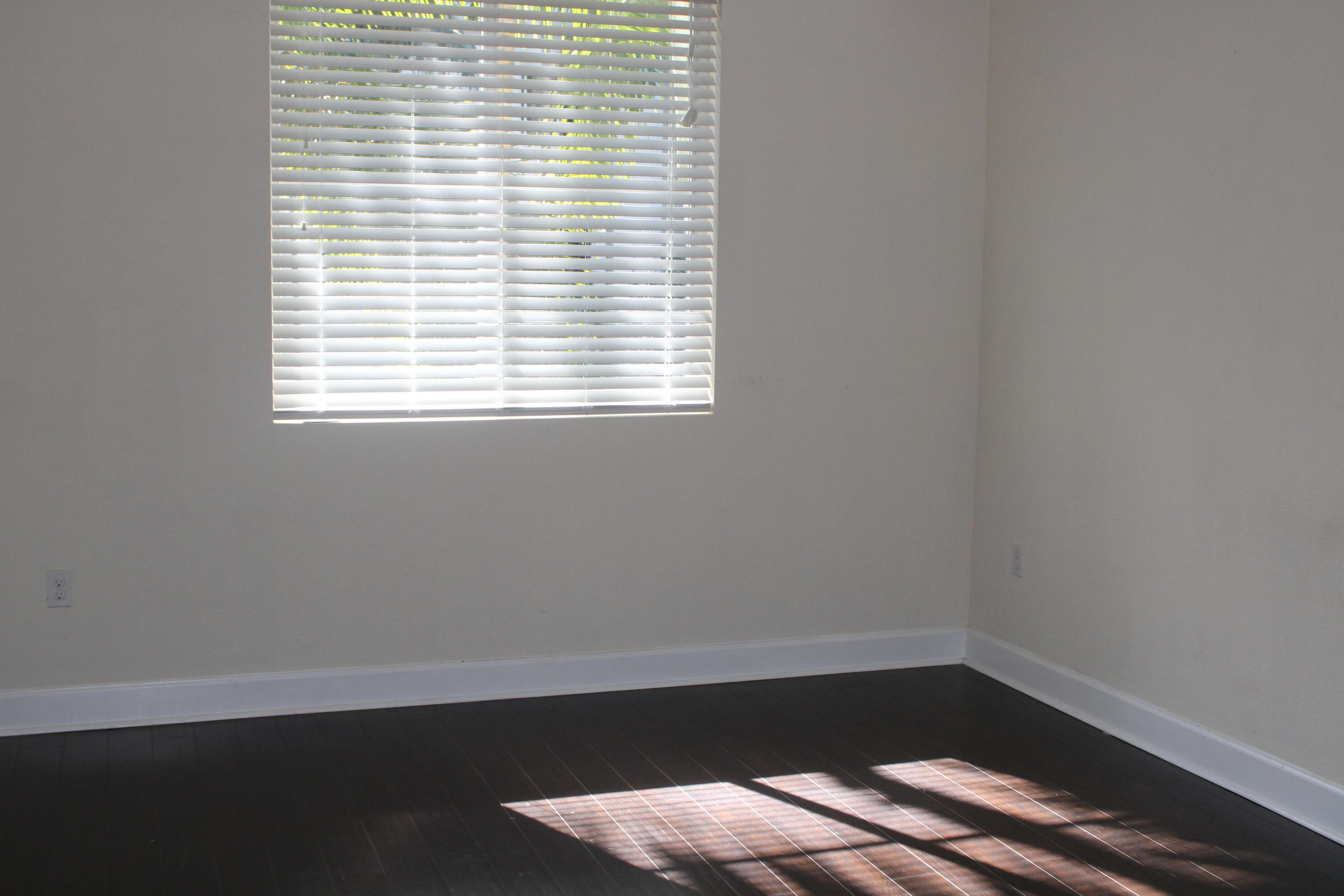 1690 Renaissance Commons Boulevard, Unit 1429 Boynton Beach, FL 33426 - Photo 16 of 23 a small space with wooden floor and a window