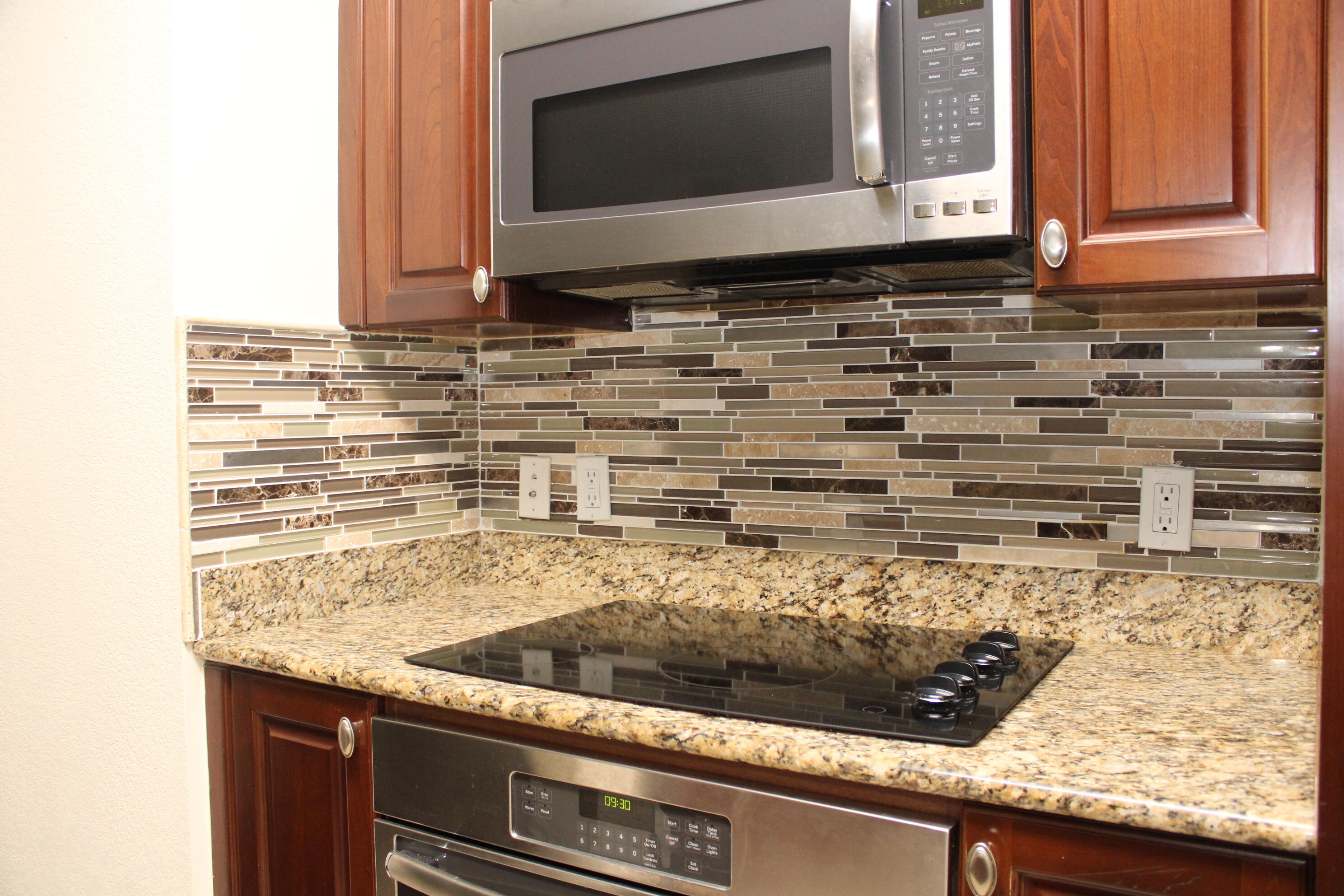1690 Renaissance Commons Boulevard, Unit 1429 Boynton Beach, FL 33426 - Photo 3 of 23 a view of kitchen counter top space and cabinets
