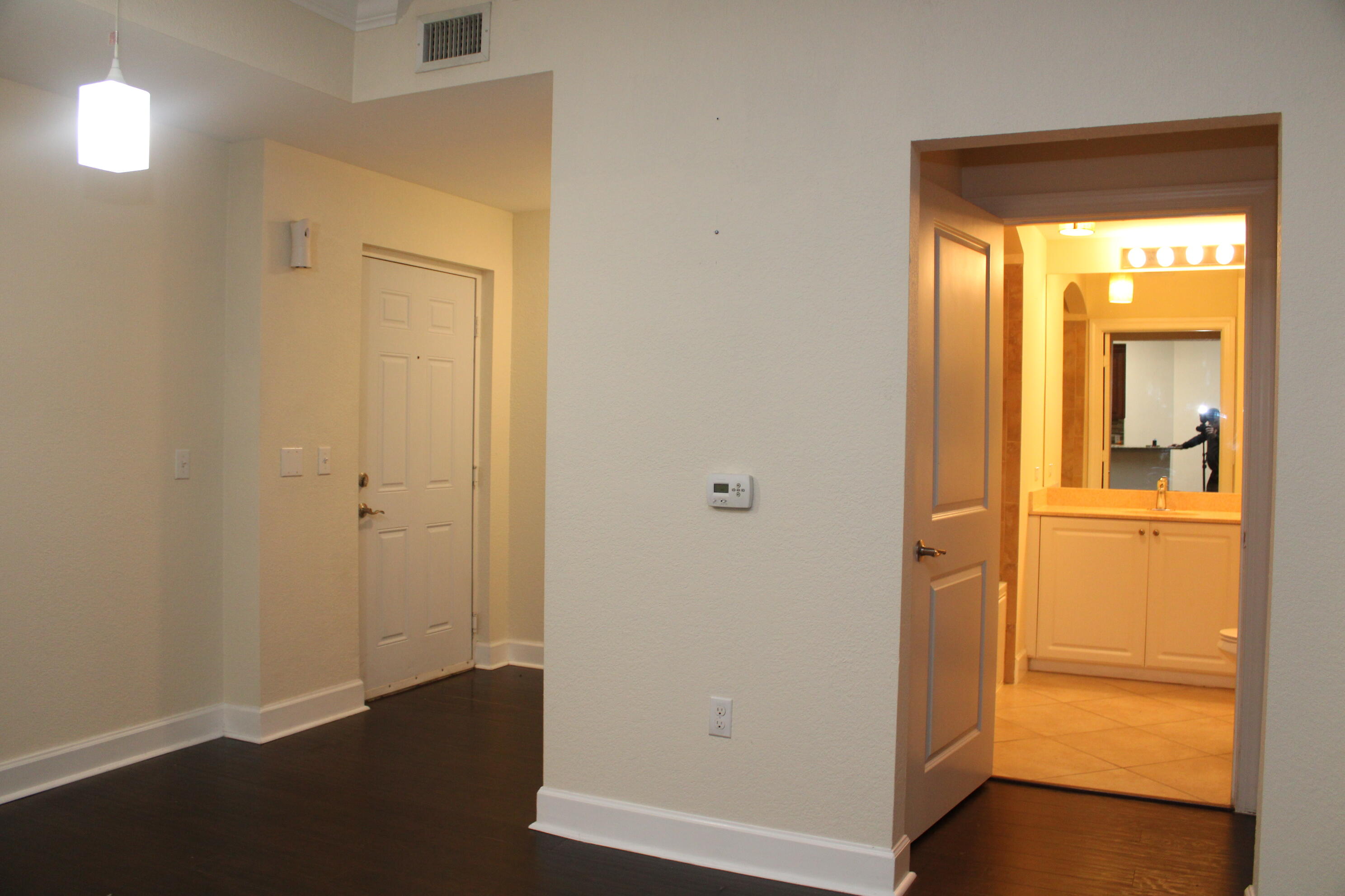 1690 Renaissance Commons Boulevard, Unit 1429 Boynton Beach, FL 33426 - Photo 9 of 23 a view of a hallway with wooden floor