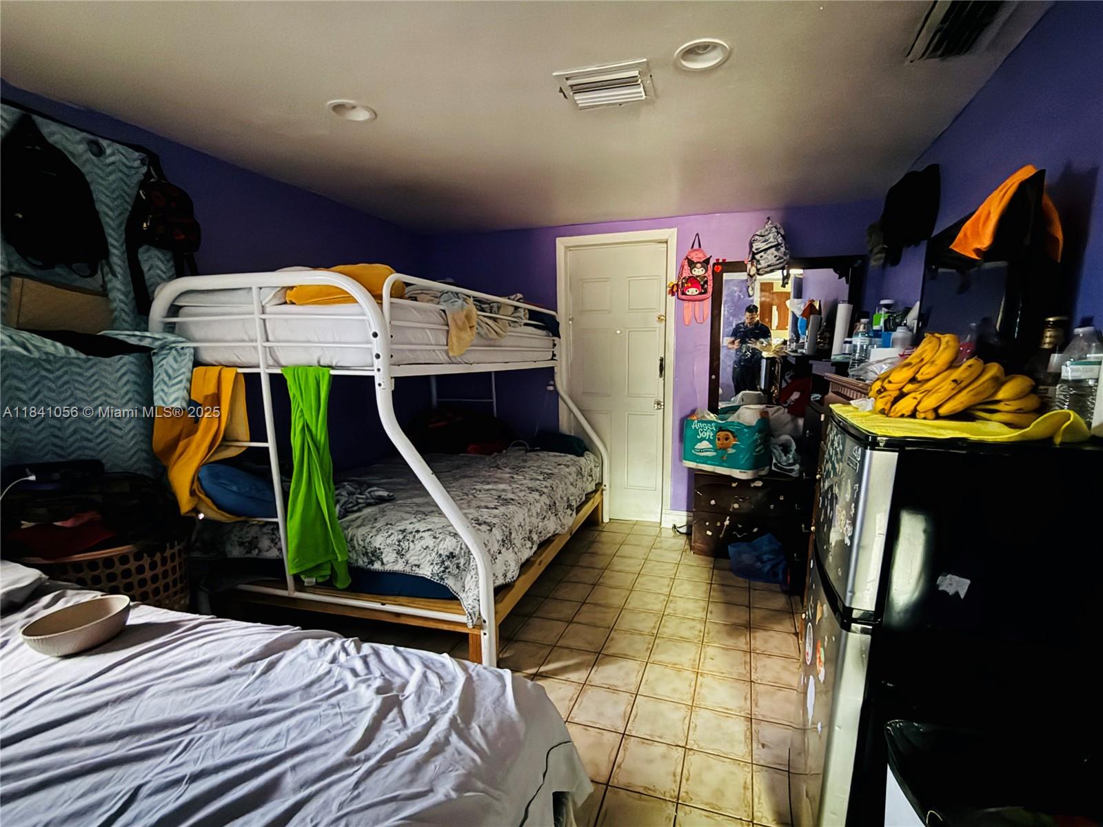 1873 Southwest 3rd Street Miami, FL 33135 - Photo 14 of 18 a view of gym equipment and kitchen floor