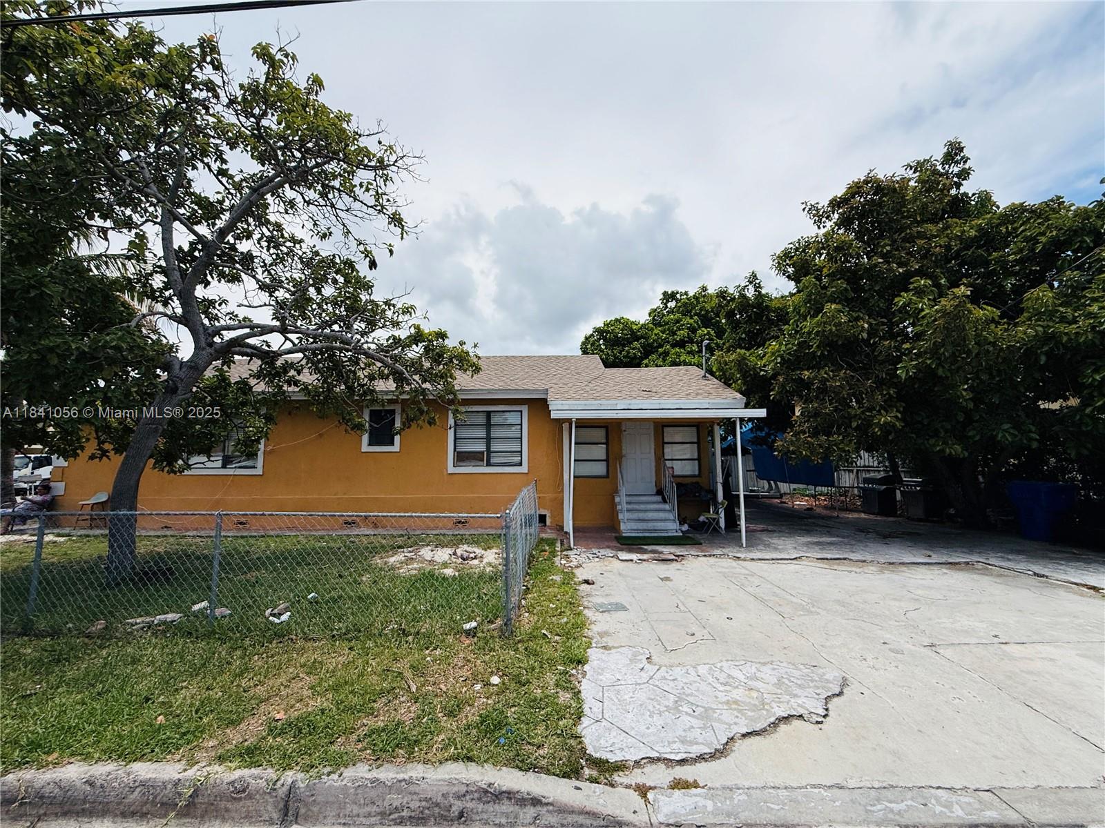 1873 Southwest 3rd Street Miami, FL 33135 - Photo 3 of 18 front view of a house with yard