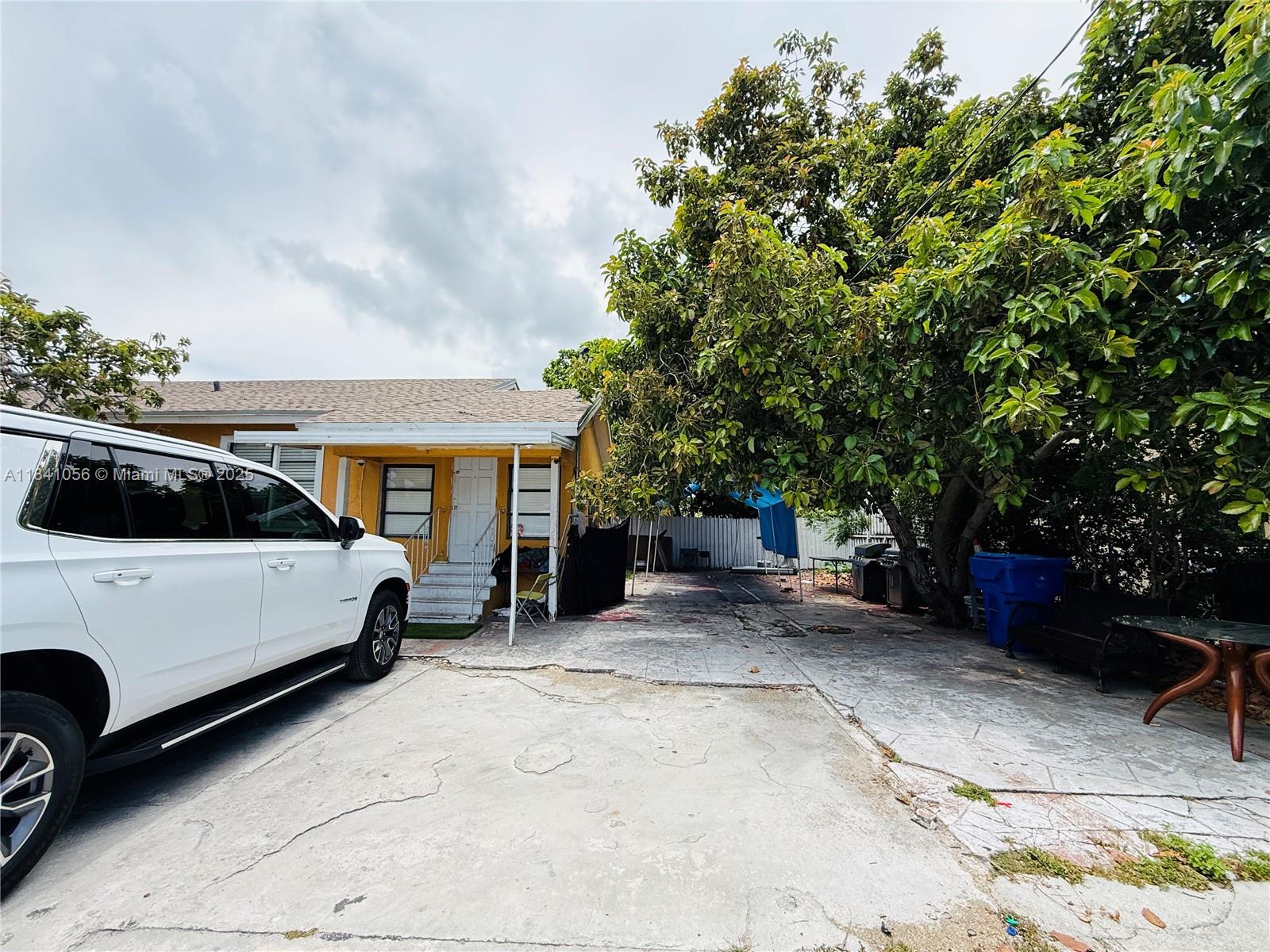 1873 Southwest 3rd Street Miami, FL 33135 - Photo 6 of 18 a view of a car parked in back of a house