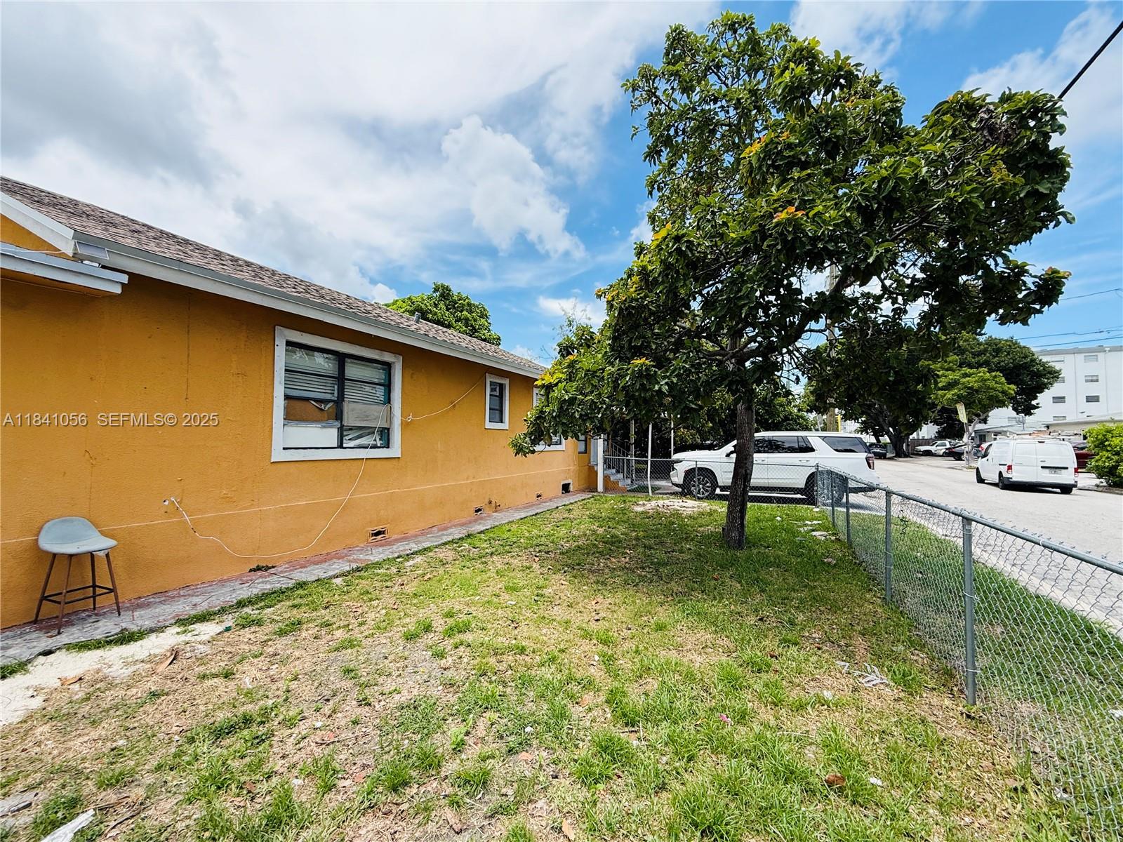 1873 Southwest 3rd Street Miami, FL 33135 - Photo 10 of 18 a backyard of a house with table and chairs