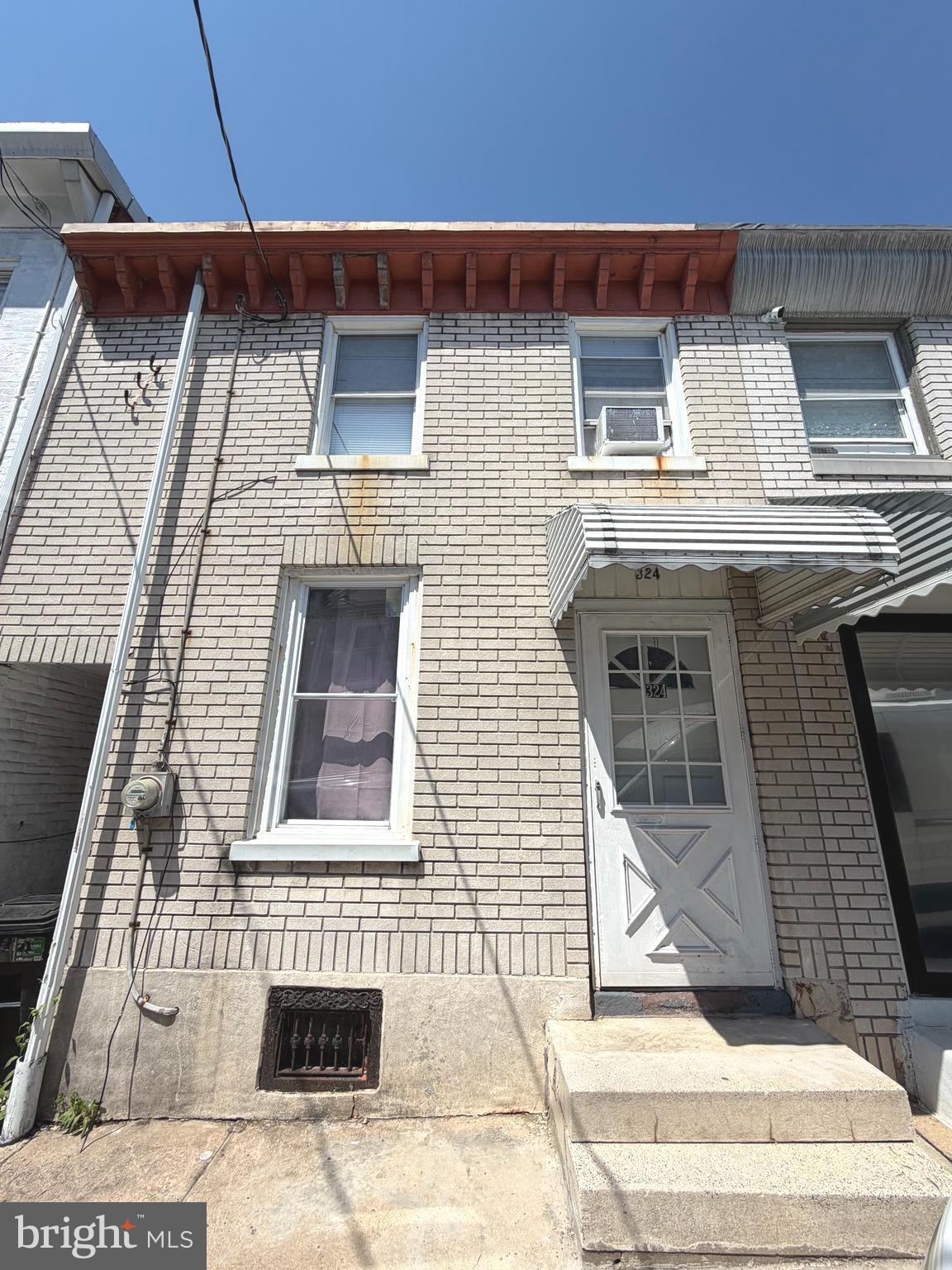 324 Spring Garden Street Reading, PA 19602 - Photo 2 of 20 a front view of a house with garage