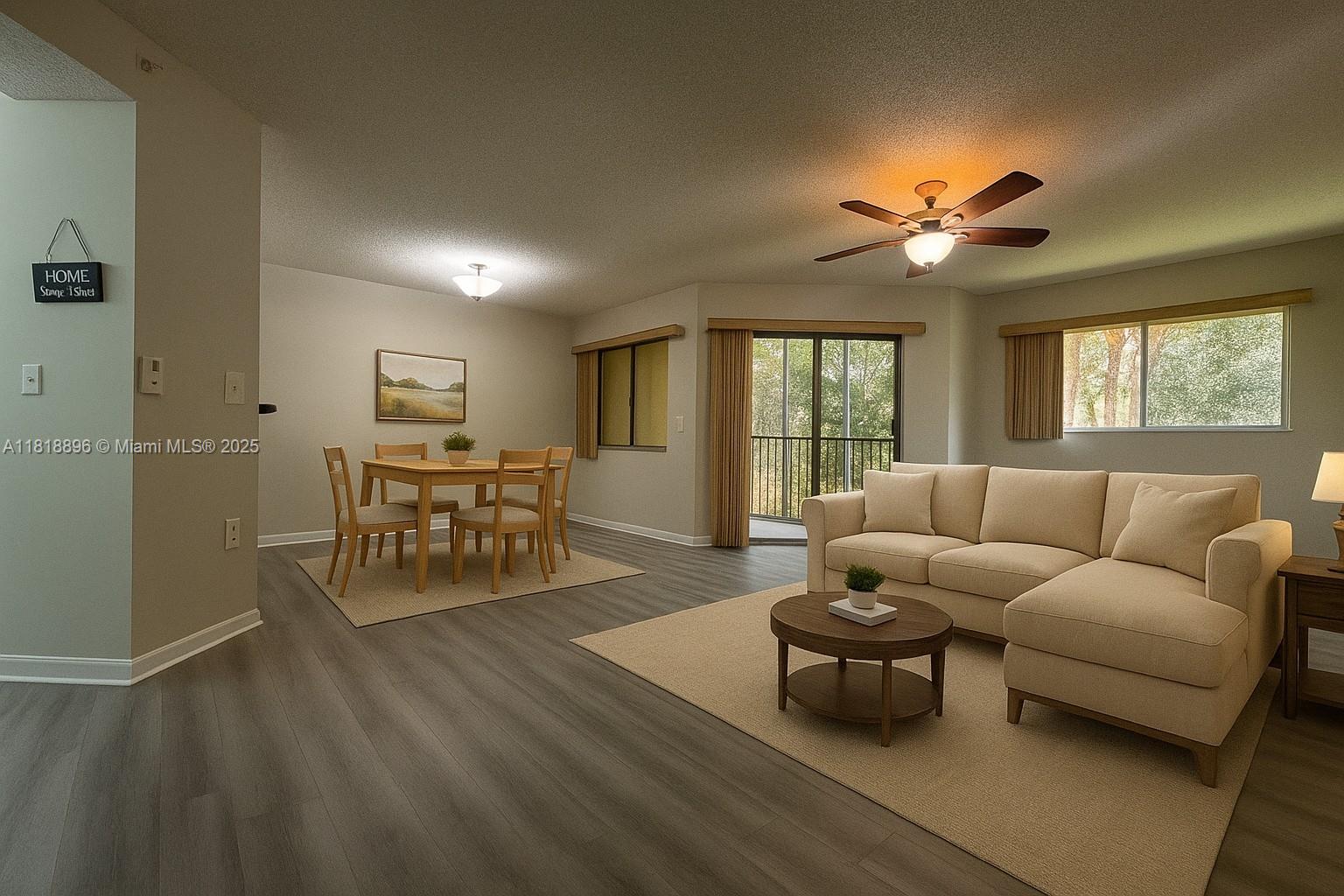 800 Southwest 142nd Avenue, Unit 211N Pembroke Pines, FL 33027 - Photo 12 of 28 a living room with furniture and a large window