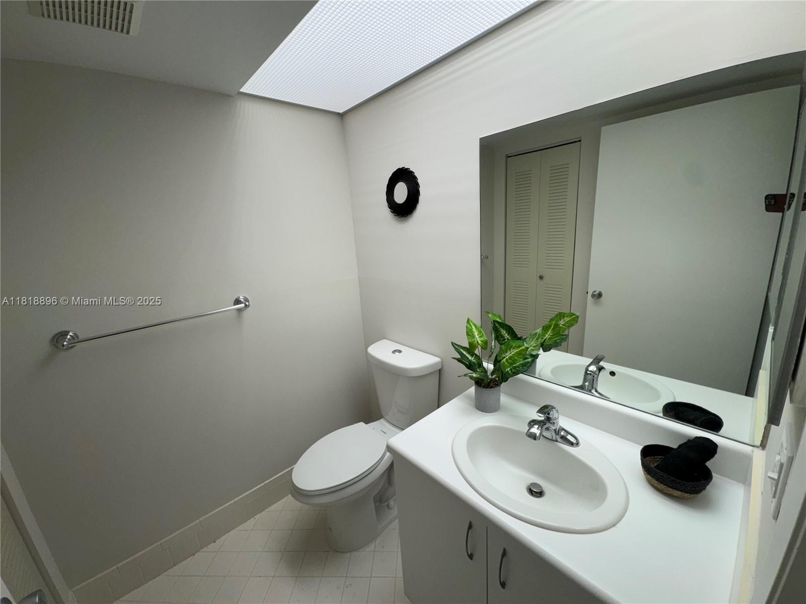 800 Southwest 142nd Avenue, Unit 211N Pembroke Pines, FL 33027 - Photo 15 of 28 a bathroom with a sink toilet and shower