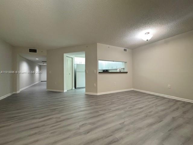 800 Southwest 142nd Avenue, Unit 211N Pembroke Pines, FL 33027 - Photo 17 of 28 a view of empty room with wooden floor