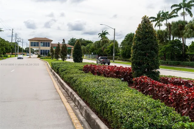 a view of a lake with houses in the back