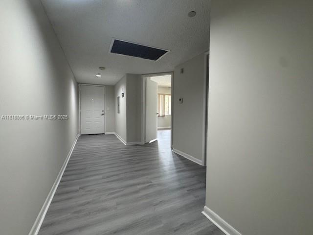 800 Southwest 142nd Avenue, Unit 211N Pembroke Pines, FL 33027 - Photo 3 of 28 a view of a hallway with wooden floor
