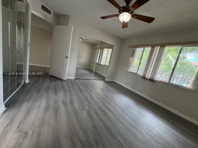 800 Southwest 142nd Avenue, Unit 211N Pembroke Pines, FL 33027 - Photo 5 of 28 wooden floor in an empty room with a window