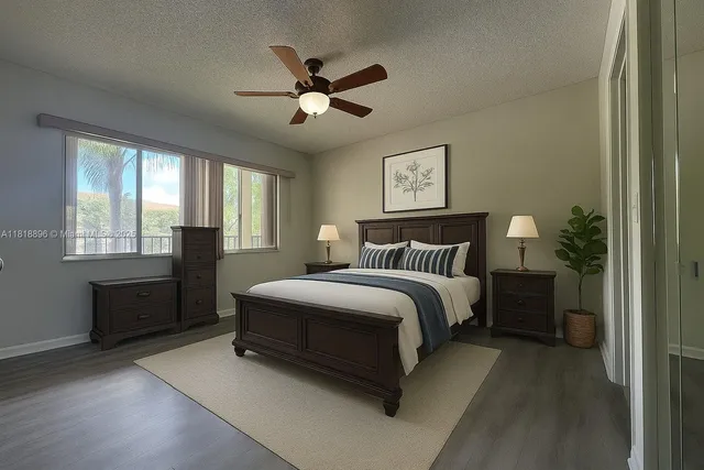 a spacious bedroom with a bed and a chandelier