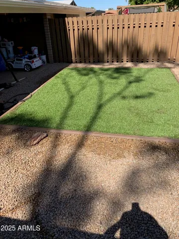 a backyard of a house with lots of green space