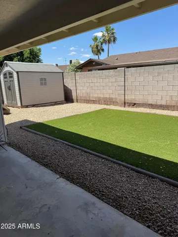 a view of a back yard of the house